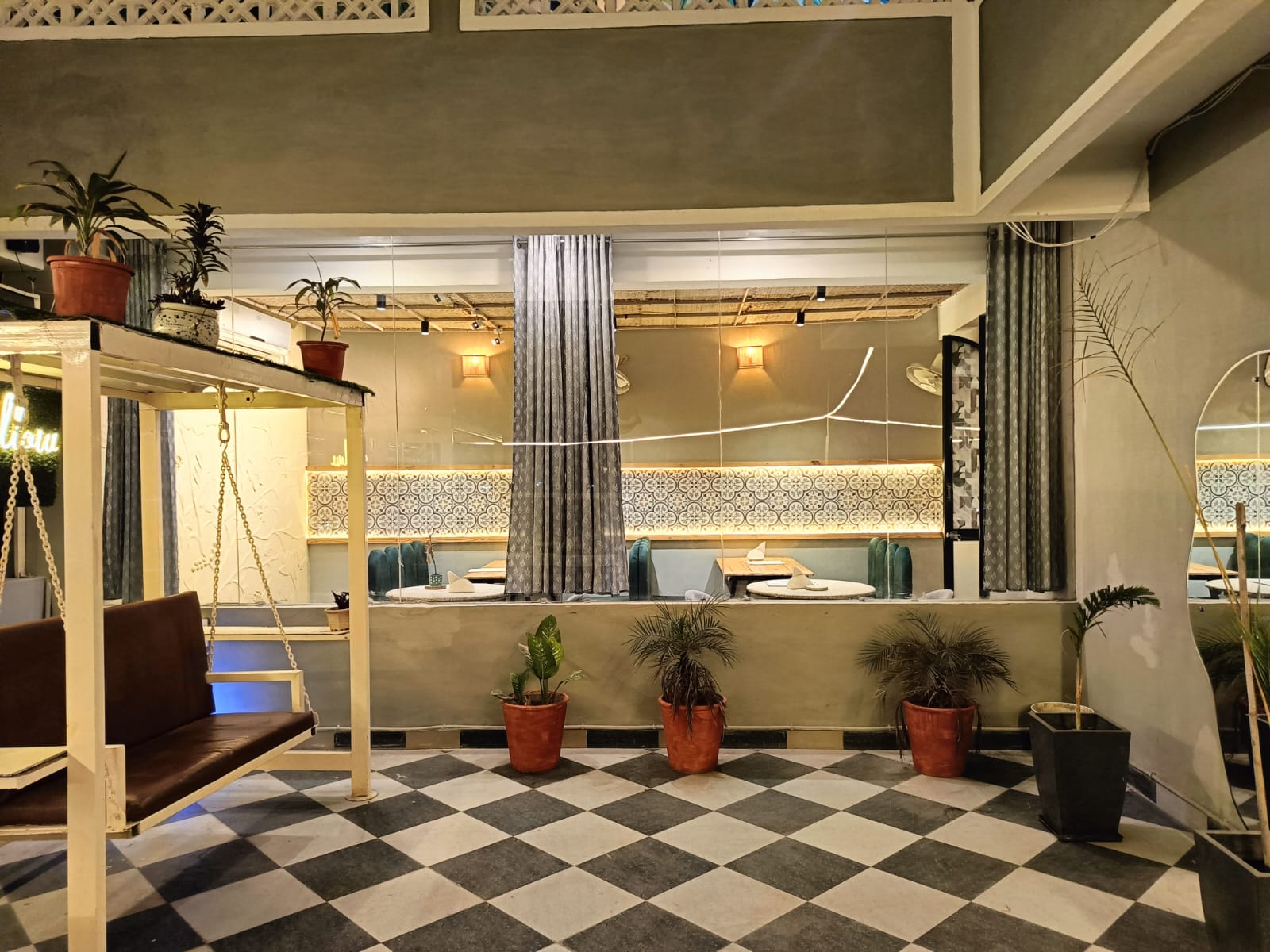 Rooftop cafe in Kota with cozy seating and evening lighting